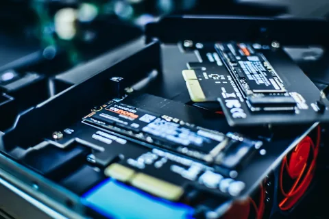 Close-up of NVMe M.2 SSDs installed in a gaming PC storage bay